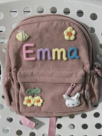 LumiaBag en color rosa palo con el nombre Emma tejido